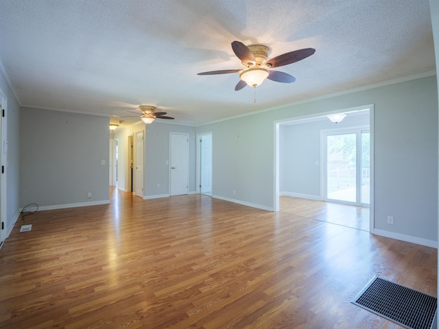405 NW Whispering Pines Loop, Madison, FL 32340 - empty room featuring ceiling fan, light wood finished floors, a textured ceiling, and ornamental molding