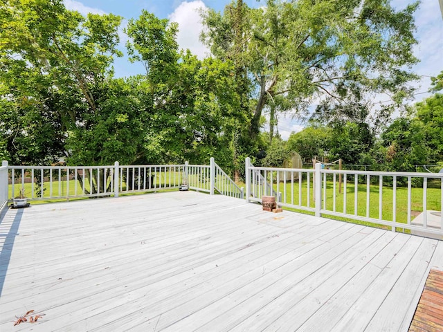 405 NW Whispering Pines Loop, Madison, FL 32340 - wooden terrace with view of scattered trees and a lawn