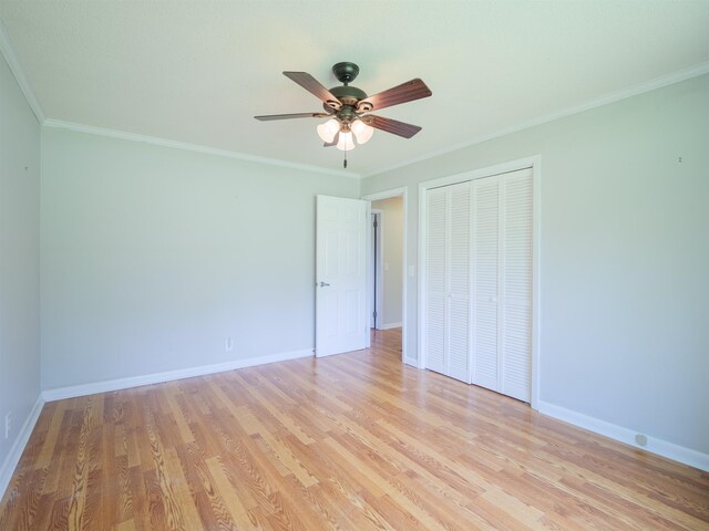405 NW Whispering Pines Loop, Madison, FL 32340 - unfurnished bedroom with a closet, ornamental molding, light wood finished floors, and a ceiling fan