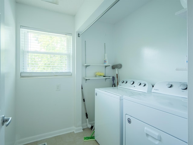 405 NW Whispering Pines Loop, Madison, FL 32340 - laundry area featuring separate washer and dryer and light tile patterned floors