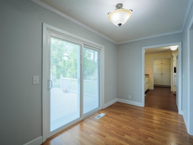 405 NW Whispering Pines Loop, Madison, FL 32340 - empty room with wood finished floors and ornamental molding