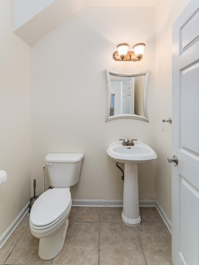 bathroom featuring tile patterned flooring and toilet