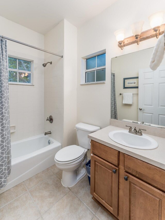 full bathroom with toilet, vanity, tile patterned flooring, and shower / bathtub combination with curtain