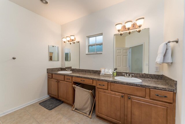 bathroom featuring tile patterned flooring and vanity