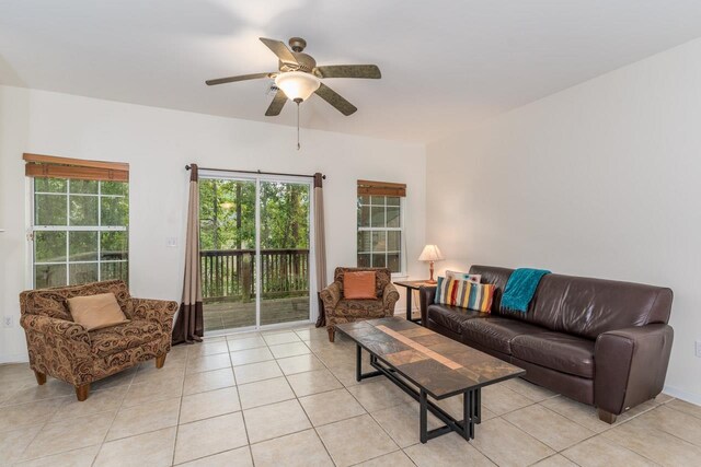 living room featuring light tile patterned floors and ceiling fan