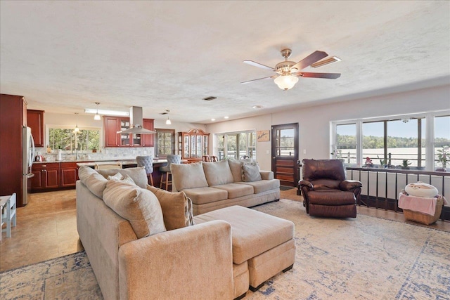 2995 Luther Hall Rd, Tallahassee, FL 32310 - living room featuring a textured ceiling, visible vents, and a ceiling fan