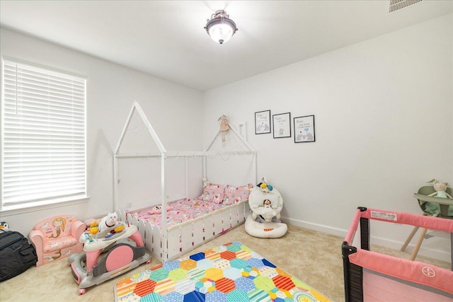 bedroom featuring carpet floors, baseboards, and visible vents