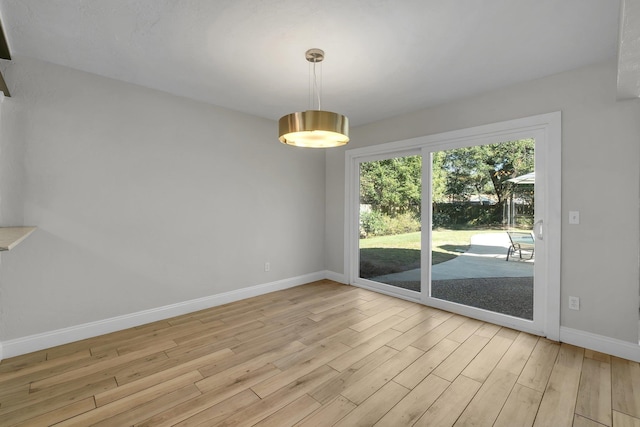 unfurnished room featuring light hardwood / wood-style floors