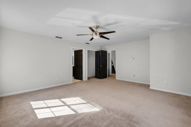 unfurnished bedroom with light carpet and ceiling fan