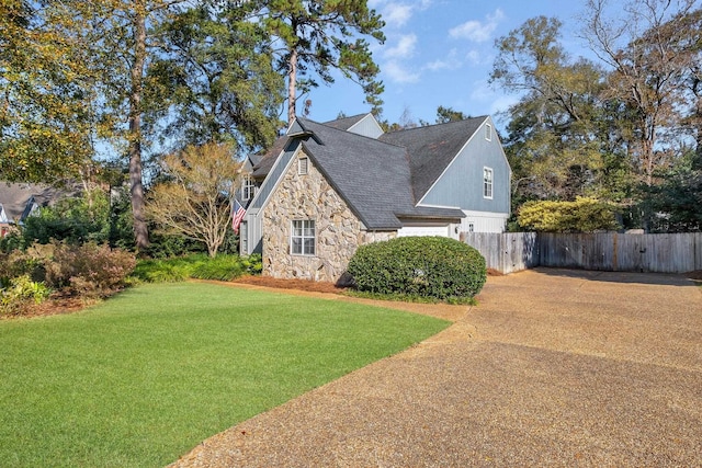 view of home's exterior featuring a yard