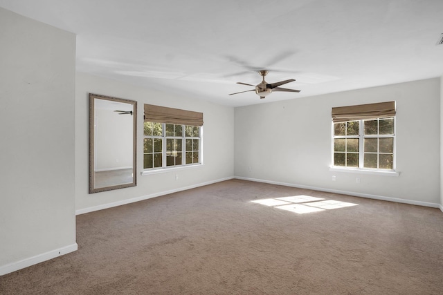 unfurnished room featuring ceiling fan and carpet floors