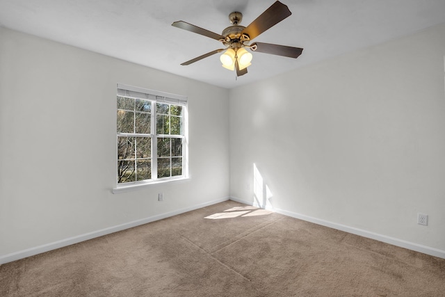 carpeted empty room with ceiling fan