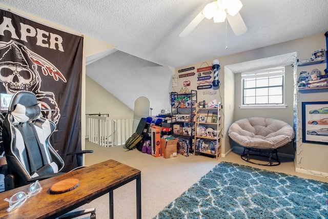 home office featuring ceiling fan, carpet floors, and a textured ceiling