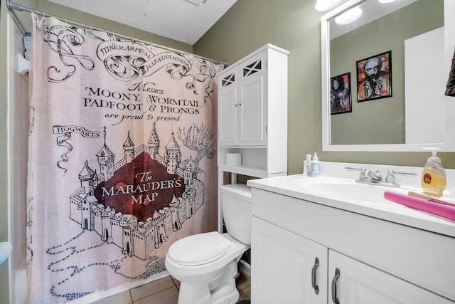 bathroom featuring tile patterned floors, a shower with curtain, toilet, a textured ceiling, and vanity