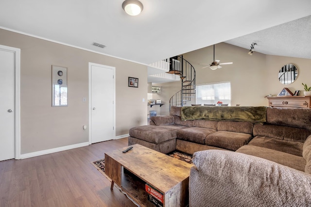 living room featuring vaulted ceiling, ceiling fan, and wood-type flooring