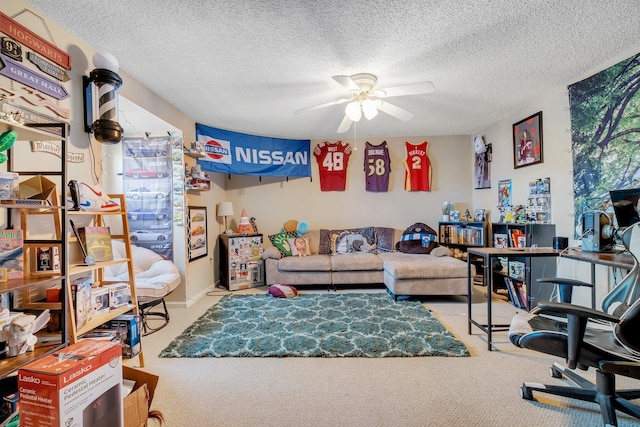 living room featuring light carpet, ceiling fan, and a textured ceiling