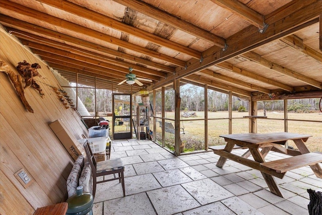 unfurnished sunroom with plenty of natural light and ceiling fan