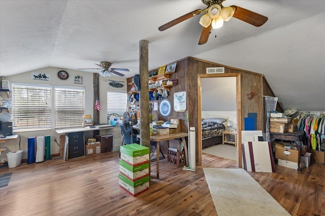 office space with vaulted ceiling and wood-type flooring