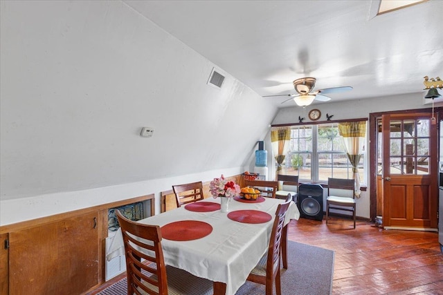 dining area featuring lofted ceiling and ceiling fan