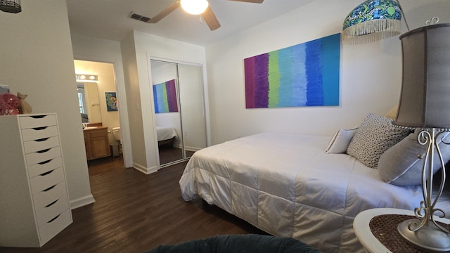 2301 Timber Oaks Ln Bldg 2, Tallahassee, FL 32304 - bedroom featuring dark wood-style floors, a closet, baseboards, ceiling fan, and ensuite bath