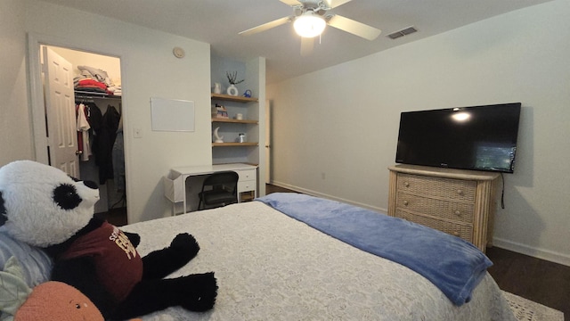 2301 Timber Oaks Ln Bldg 2, Tallahassee, FL 32304 - bedroom with baseboards, a walk in closet, wood finished floors, a closet, and ceiling fan