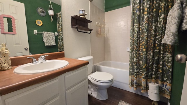 2301 Timber Oaks Ln Bldg 2, Tallahassee, FL 32304 - full bathroom featuring toilet, vanity, shower / tub combo, and wood finished floors