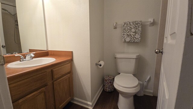 2301 Timber Oaks Ln Bldg 2, Tallahassee, FL 32304 - bathroom with toilet, vanity, baseboards, and wood finished floors
