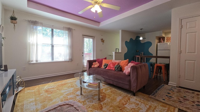 2301 Timber Oaks Ln Bldg 2, Tallahassee, FL 32304 - living room featuring wood finished floors, ceiling fan, baseboards, and a raised ceiling