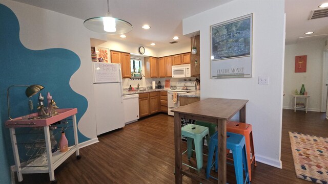 2301 Timber Oaks Ln Bldg 2, Tallahassee, FL 32304 - kitchen featuring white appliances, dark wood-type flooring, light countertops, hanging light fixtures, and recessed lighting