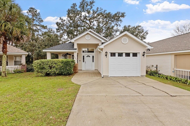 ranch-style house featuring a porch, a garage, and a front lawn