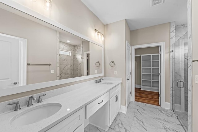 bathroom featuring vanity and walk in shower