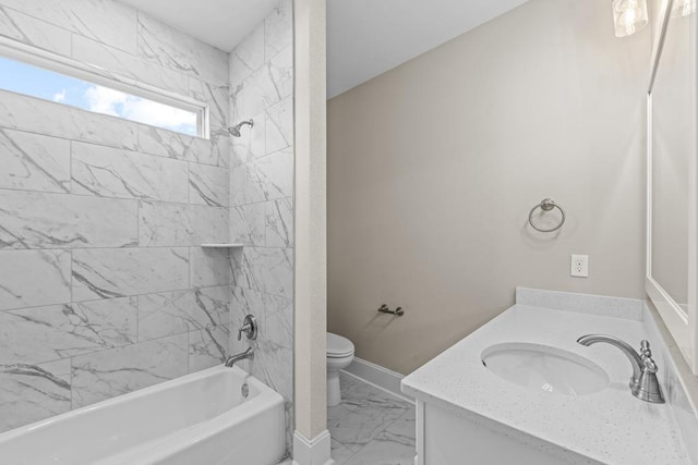 full bathroom with vanity, toilet, and tiled shower / bath combo