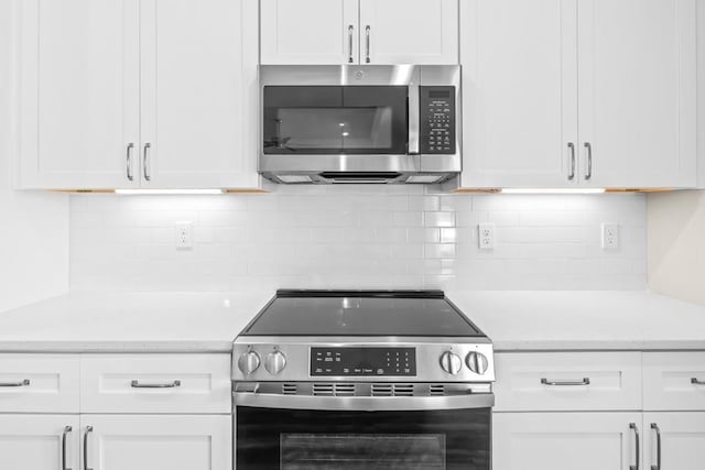 kitchen with white cabinets and stainless steel appliances