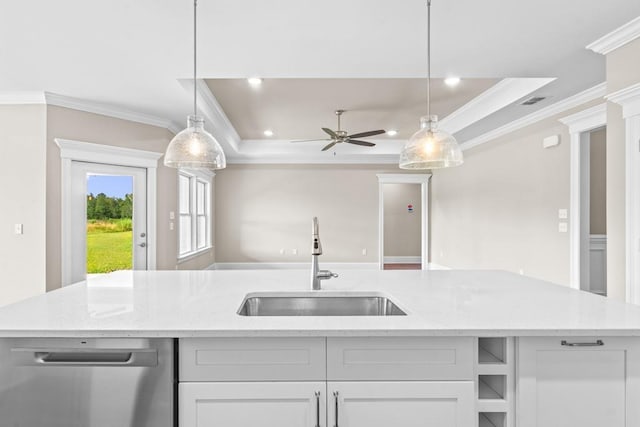 kitchen with white cabinets, stainless steel dishwasher, a kitchen island with sink, and sink