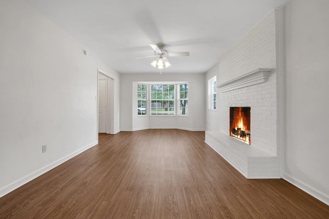 5804 Old Forge Ct, Tallahassee, FL 32317 - unfurnished living room featuring wood finished floors, ceiling fan, and a fireplace