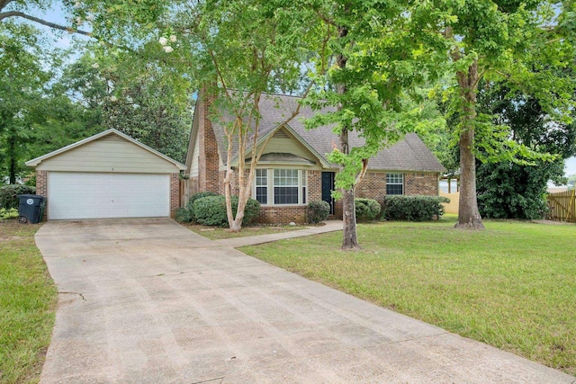 5804 Old Forge Ct, Tallahassee, FL 32317 - view of front of home featuring brick siding, a garage, an outbuilding, and a shingled roof
