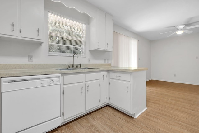 5804 Old Forge Ct, Tallahassee, FL 32317 - kitchen with white dishwasher, light wood-style flooring, white cabinets, ceiling fan, and light countertops