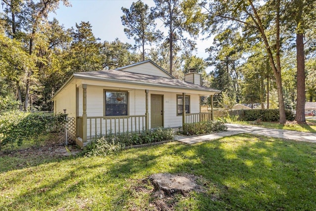 bungalow-style house with a porch and a front yard