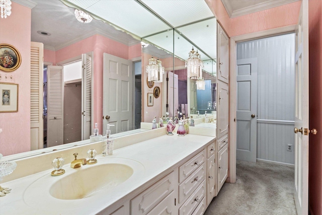 bathroom featuring ornamental molding and vanity