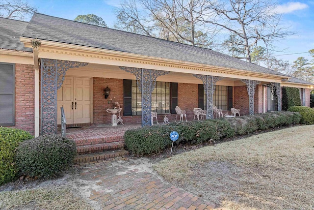 doorway to property featuring covered porch