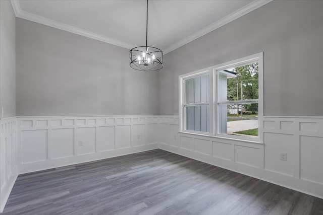 10096 Green Fountain Rd, Tallahassee, FL 32305 - unfurnished dining area featuring crown molding, a chandelier, wood finished floors, a decorative wall, and a wainscoted wall