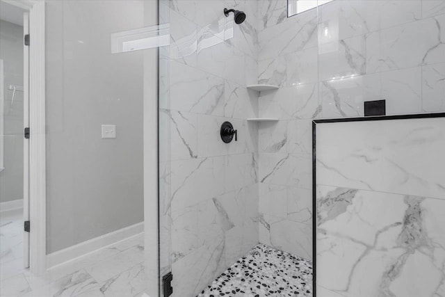 10096 Green Fountain Rd, Tallahassee, FL 32305 - bathroom featuring a marble finish shower, marble look tiles, and baseboards