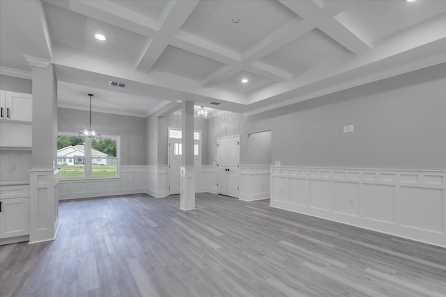 10096 Green Fountain Rd, Tallahassee, FL 32305 - unfurnished living room featuring coffered ceiling, a decorative wall, crown molding, light wood-style flooring, and beamed ceiling