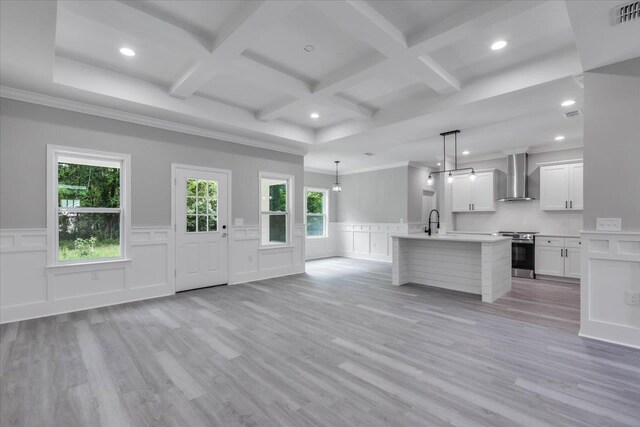 10096 Green Fountain Rd, Tallahassee, FL 32305 - kitchen with wall chimney range hood, stainless steel electric stove, coffered ceiling, light countertops, and a wainscoted wall