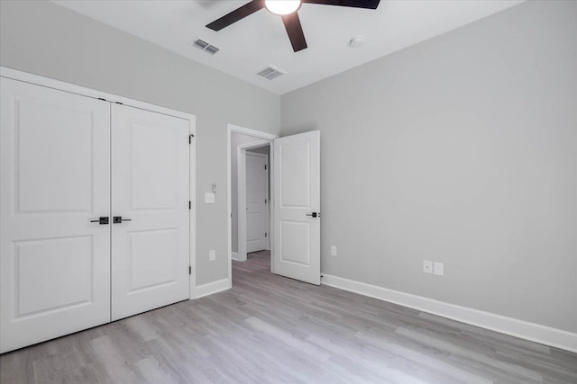 10096 Green Fountain Rd, Tallahassee, FL 32305 - unfurnished bedroom with light wood-type flooring, baseboards, a closet, and a ceiling fan