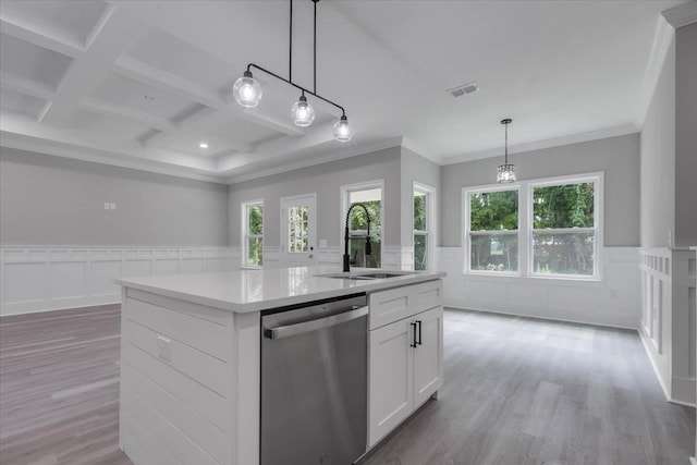 10096 Green Fountain Rd, Tallahassee, FL 32305 - kitchen with stainless steel dishwasher, wainscoting, a sink, hanging light fixtures, and a center island with sink