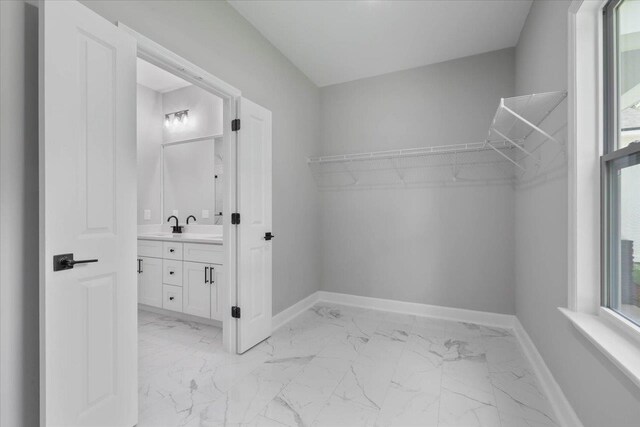 10096 Green Fountain Rd, Tallahassee, FL 32305 - spacious closet with light marble finish flooring