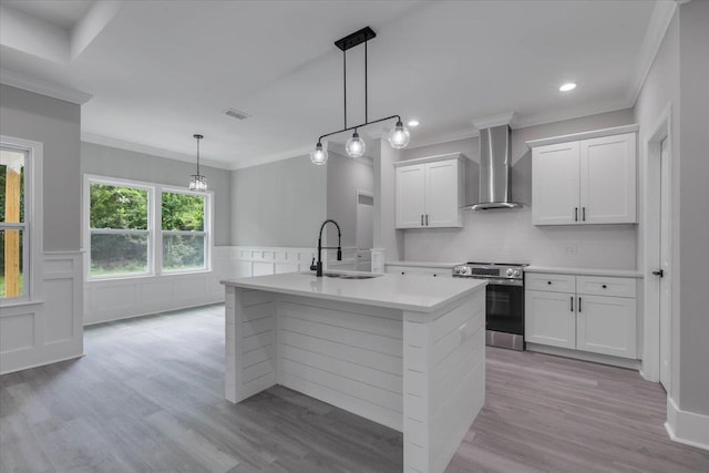 10096 Green Fountain Rd, Tallahassee, FL 32305 - kitchen with stainless steel range with electric stovetop, wall chimney exhaust hood, a sink, light countertops, and light wood finished floors