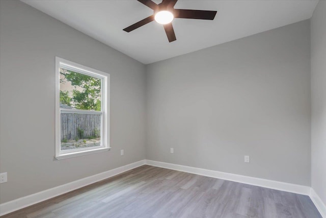 10096 Green Fountain Rd, Tallahassee, FL 32305 - unfurnished room featuring wood finished floors, a ceiling fan, and baseboards