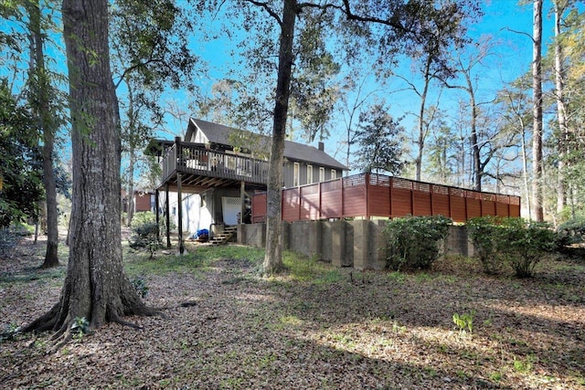 rear view of property with a chimney